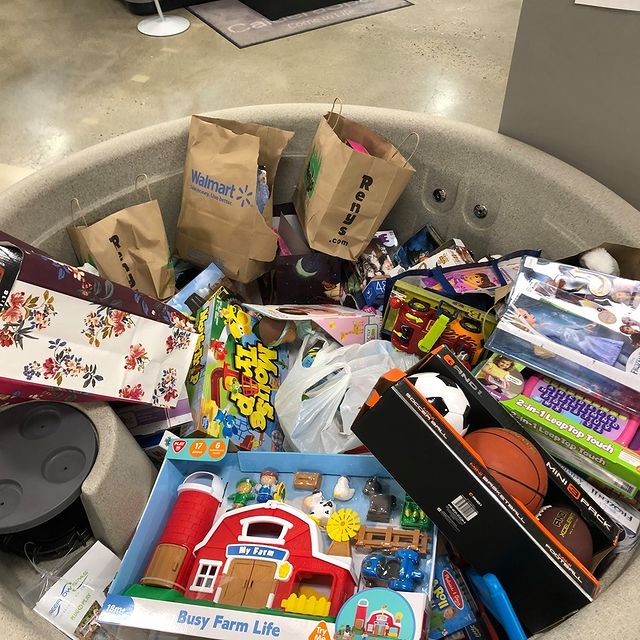 Toy donations for Toys for Tots inside of a hot tub in the Scarborough showroom.