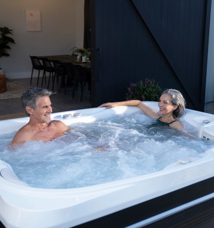 Man and woman enjoying the Caldera Utopia Ravello hot tub