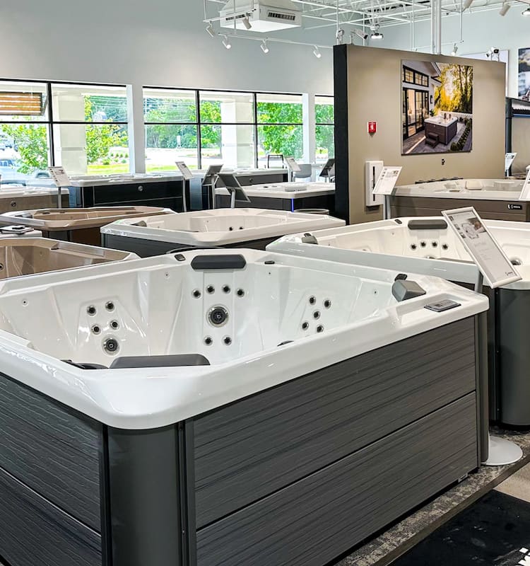Interior shot of hot tubs in the Hanover showroom. Focus on the hotspring hotspot collection