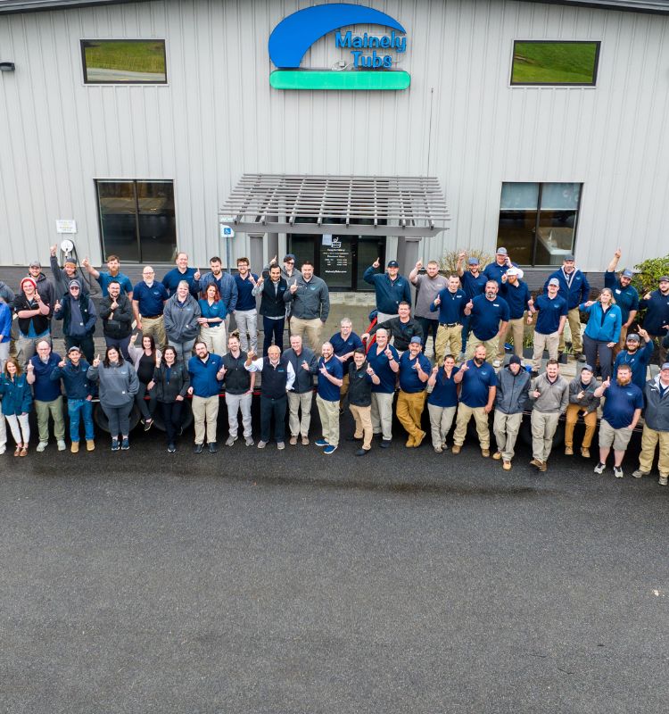 Mainely Tubs Company Photo at 2023 All Hands Meeting with everyone wearing Mainely Tubs blue or gray shirts
